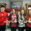 Barton County City Clover members, left to right, Ryan Davis, Kaitlyn Davis, Brenna Morey and Lexi Phipps, are shown displaying the festive keepsakes their club gave to the residents at Maple Senior Living. The City Clovers 4-H Club enjoys giving back to their community and hopes these gifts, along with the Angel Tree gifts they delivered to Truman Healthcare, brightened the Christmas season for the residents.
