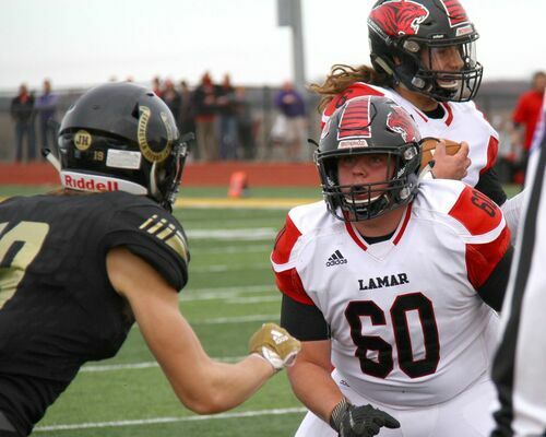 Lamar senior lineman No. 60 CJ Maldonado blocks as No. 6 Senior quarterback Duncan Gepner scores the first of three touchdowns to take an early 7-0 lead. The Tigers streak of seven straight state championships was ended by the Mules by a score of 28-21.