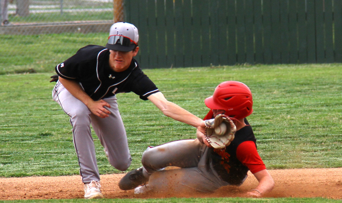 Photo by Terry Redman
Lamar shortstop Trent Tucker takes the throw late as this Columbus Titan steals second base.