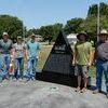 Photos courtesy of Joe Davis
The first three of the seven planned monuments arrived at the Barton County Memorial Park on Tuesday morning, Aug. 2. These black granite monuments are triangular in shape and will feature the Civil War, World War I, World War II, the Korean War, the Vietnam War and the Global War on Terror. A seventh monument will be erected that will feature the Barton County Memorial Hospital and the formation of the park. It was an extremely hot job as these dedicated workers from West Chestnut Monuments in Carthage unloaded the first three monuments off the crane, moving and securing them in their designated place. The park is located at the corner of 2nd and Gulf in Lamar and all are encouraged to stop by and see the amazing transformation that is taking place.