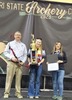 Madison Caruthers, center, received a custom finished bow, medals and trophies and a $2,500 cash scholarship to use at the school of her choice after placing as State High School Champion Female Archer and State Overall Female Champion.