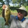 Old time river guide Dennis Whiteside knows how and where to find smallmouth, even on a hot summer day.